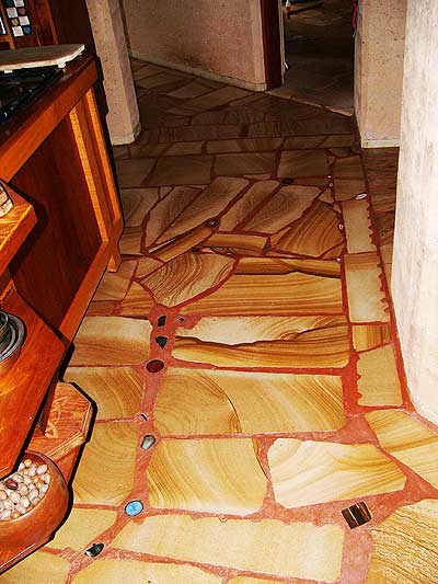 inlaid gemstones add highlights to the sandstone floors